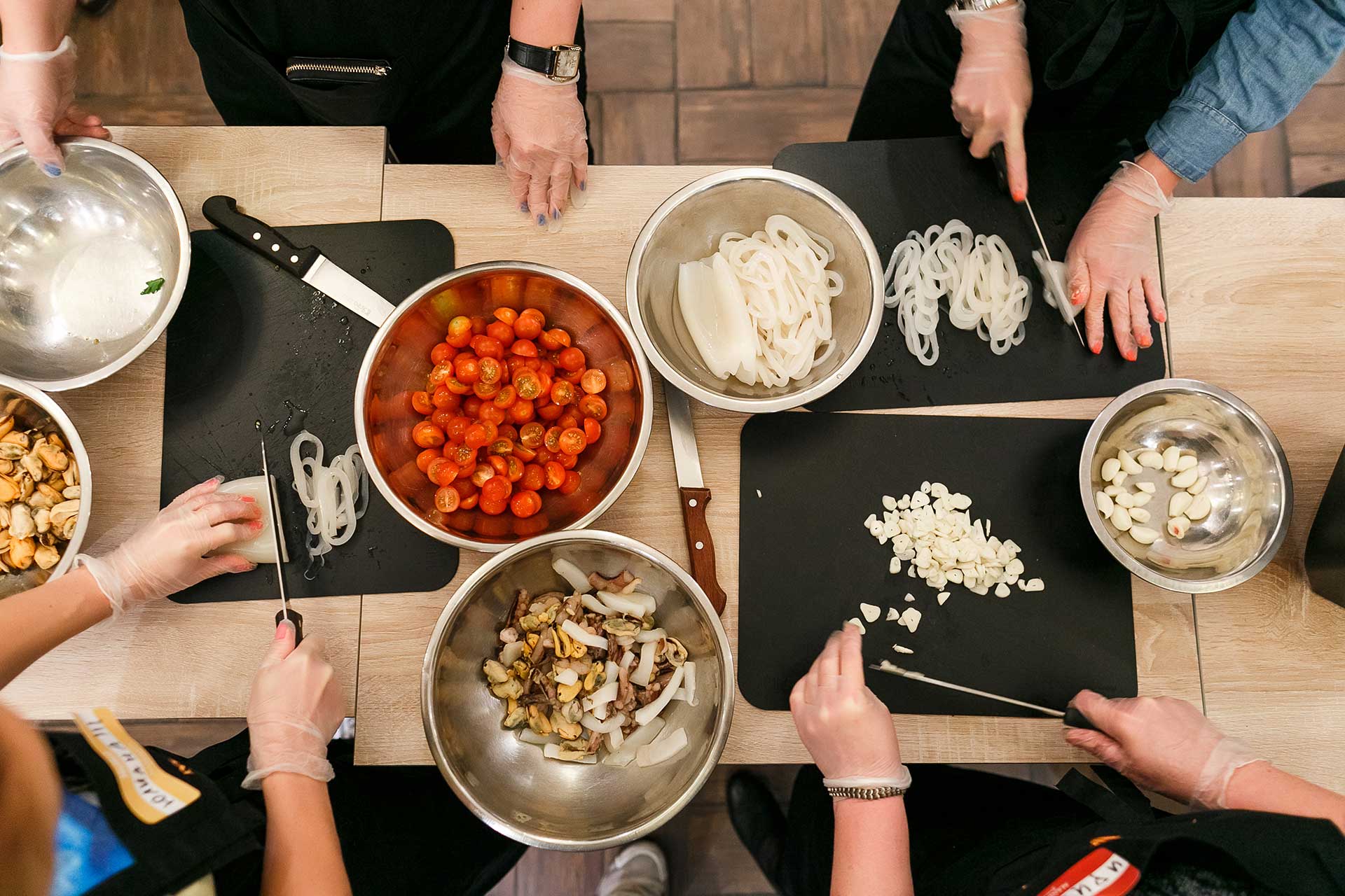 people cooking around table